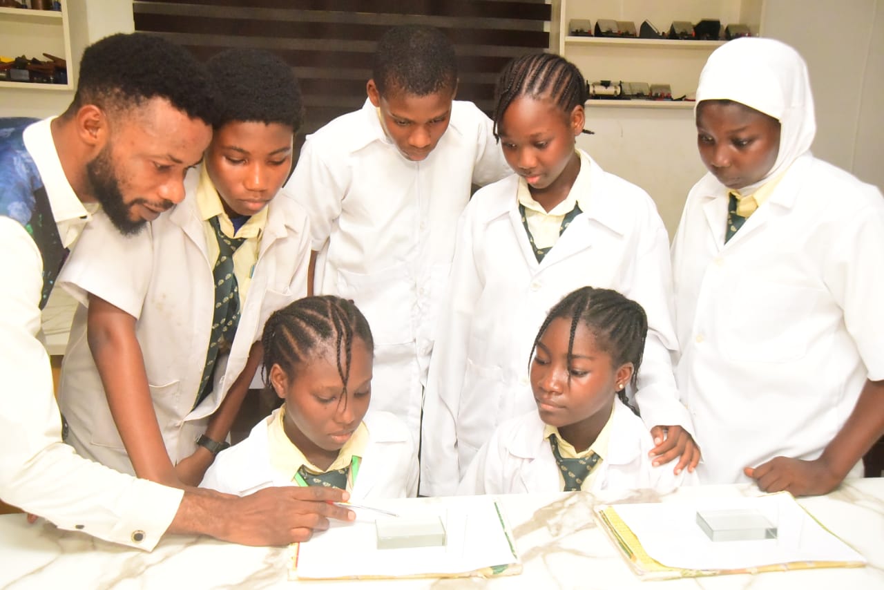 Teacher Guiding Students in Laboratory